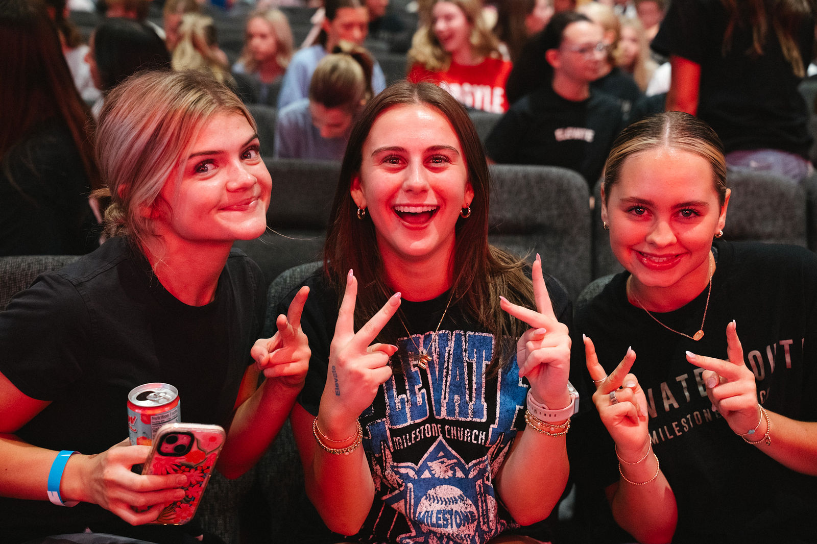 Students smiling together at an Elevate Wednesday night at the Argyle campus